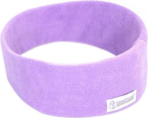 A person sleeping peacefully wearing SleepPhones headband