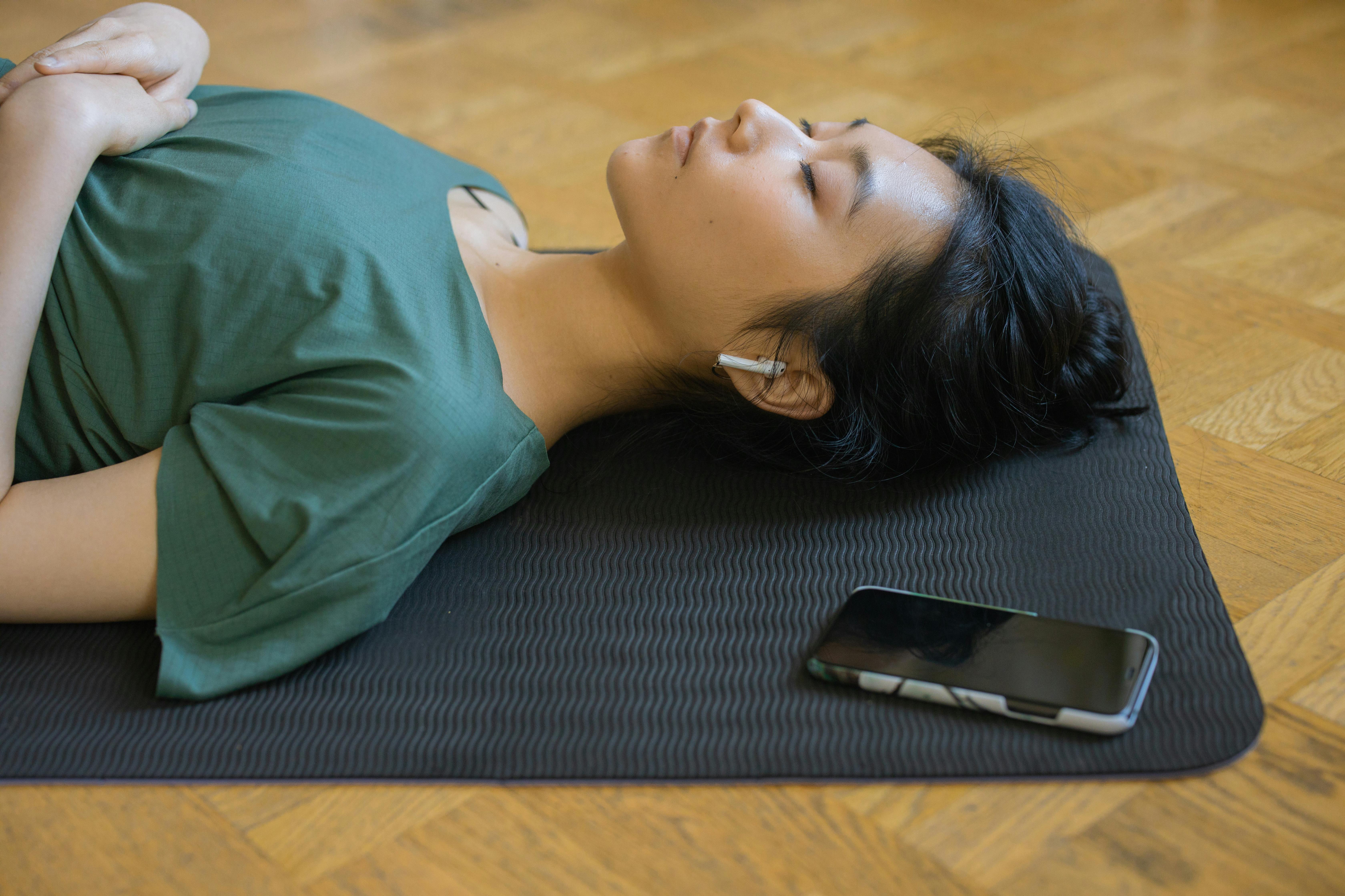 Person meditating with headphones